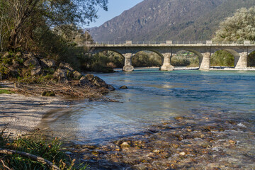 Tolmin, Slovenia - October 28, 2014: The Soca river flows through western Slovenia and its source lies in the Julian Alps. One of the most beautiful rivers in Europa, known for its emerald color.