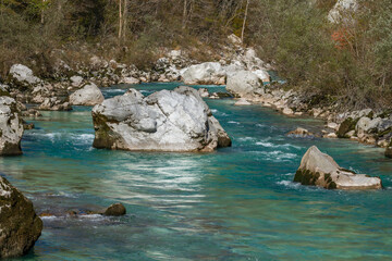 Naklejka na ściany i meble Kobarid, Slovenia - October 28, 2014: The Soca river flows through western Slovenia and its source lies in the Julian Alps. One of the most beautiful rivers in Europa, known for its emerald color.