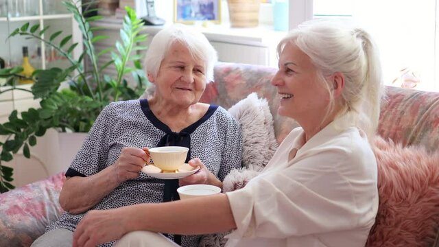 Senior woman spending quality time with her daughter
