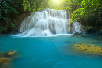 Fototapeta na wymiar Beautiful deep forest waterfall at Kanchanaburi province, Thailand.