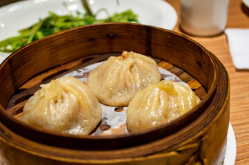 Chinese soup dumplings (Tang Bao) in a bamboo steamer