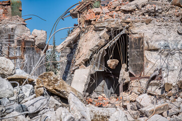 Fragments of the destroyed building. Fragments of concrete walls and foundations.
