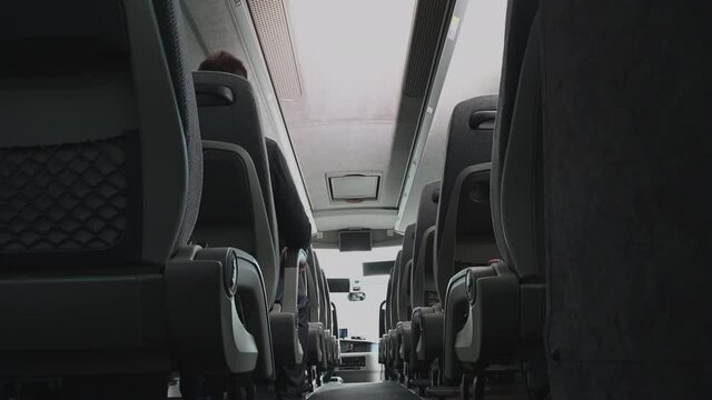 Just One Passenger Seating Inside Intercity Bus Coach. Traveling During Pandemic Virus Outbreak. Empty Bus Concept.