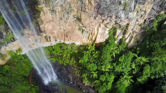 Aerial Drone View Of Flowing Water Falls Splashing Below And Lush Green Trees And Forest In Hinterland Purlingbrook Falls National Park