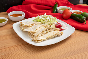 Chicken quesadilla made with Mexican cheese and free-range chicken. A cheap and easy meal from a Mexican restaurant. 