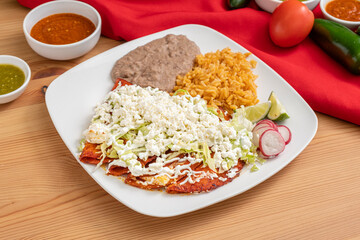 Spicy Mexican empanadas made with meat, corn tortillas, sour cream and cotija cheese.