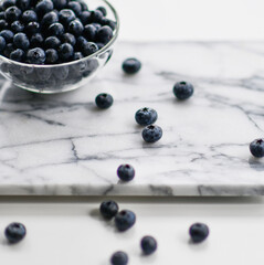 Fresh blueberries background with text copy space. Blueberry organic superfood berries in a bowl concept for healthy eating 