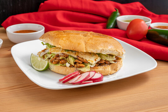 Authentic Mexican torta. A sandwich from Mexico made with fresh bread and spicy chicken.