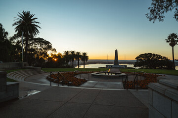 Early morning sunrise over the war memorial in Kings Park. Beautiful golden light is hitting the empty monuments. 