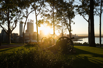 Early morning sunrise over the war memorial in Kings Park. Beautiful golden light is hitting the empty monuments. 