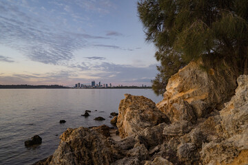 Golden sunrise over the Perth city center. A beautiful light catching the buildings as people start their day. 