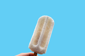White bar ice cream isolated on Pastel blue background