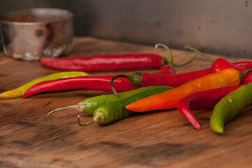 hot chili peppers on wooden background