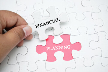 Missing puzzle with a word FINANCIAL PLANNING. Business concept puzzle piece. Business and finance concept.