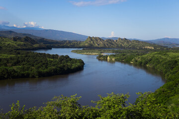 Fototapeta na wymiar Wavy dam or river with nature in sunny day