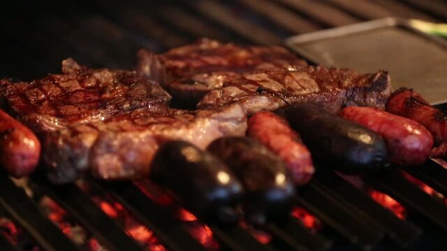 raw meat and vegetables in an argentinian barbecue ready to grill