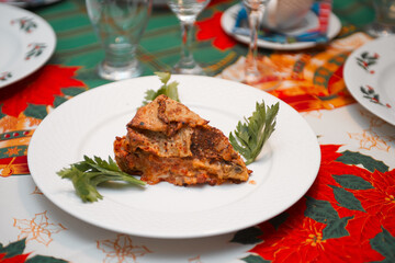 Close up of timballo slice on a dish