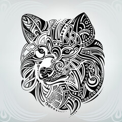 Silhouette of the head of a wolf in an ornament