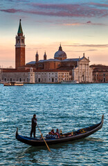 Venice at sunset, with gondols in the canals © Bernardo Galmarini