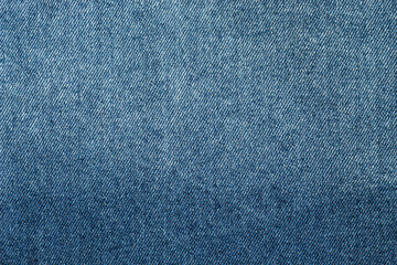 closeup to a gradient Blue jean texture. Fashion concept 