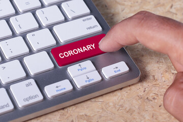 Man pressed keyboard button with coronary word