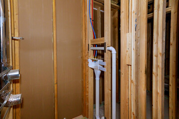 Fototapeta na wymiar Under construction laundry room in a new home house beam framing