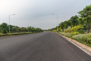 Fototapeta na wymiar Perspective view of wide asphalt road