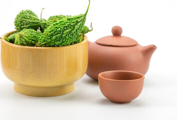 green bitter gourd in a wooden cup