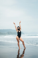 Young girl resting by the sea in quarantine