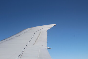 Fototapeta na wymiar airplane wing on the sky