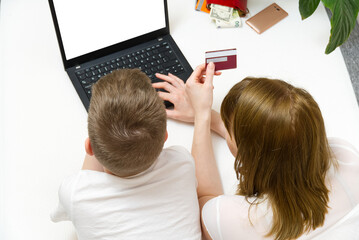 Mother with son making online shopping in laptop. Online shopping with laptop from home concept. mock up.