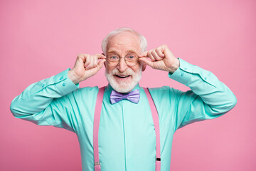 Photo of excited attractive grandpa good mood holding hands on specs glad nice eyesight wear mint...