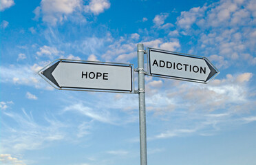 Road sign to addiction and hope
