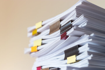Pile of student homework that assigned to student to be completed outside class on teacher desk...