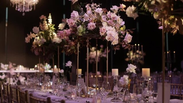 Wedding table setting with pink and white floral centrepiece