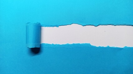 Blue Torn paper with space for text with black background