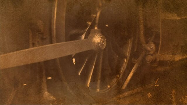 Close up of steam train wheels moving UK