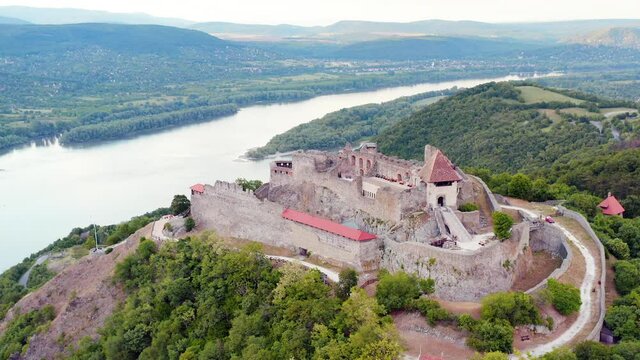 Amazing 4k aerial footage about the Visegrad castle. n Hungary.  Fantastic historical castle ruin in Danube bend. Popular tourist destination. Bright colorful video when the castle is empty. 