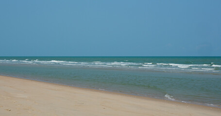 Fototapeta na wymiar Sand beach ocean and sunny day