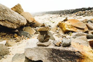 Fototapeta na wymiar Rocks on the beach on an overcast day