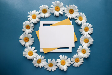 bouquet of white daisies on a blue background.