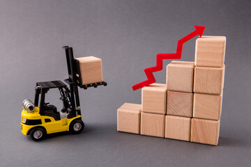 Photo of small loader bringing wooden boxes supply management building new progress marketing service growing profit arrow pointing up isolated over dark pastel grey color background