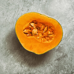 Half of raw pumpkin close-up on a vintage gray concrete background. Top view, flat lay, square.