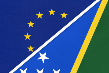 European Union or EU and Solomon Islands national flag from textile. Symbol of the Council of Europe association.