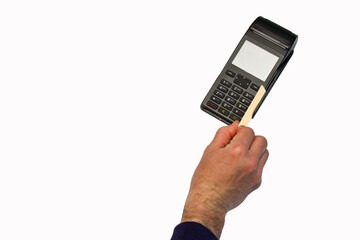 The hand holds a credit card on the payment terminal. Isolated on white background