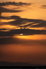 Dramatic Sunrise with the sun behind the clouds 