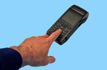 Hand enters PIN - password - isolated on blue background. Security of payments.