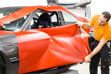 Carwrapping with red adhesive film