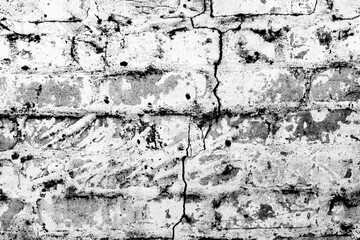 Texture of a brick wall with cracks and scratches which can be used as a background