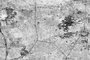 Texture of a concrete wall with cracks and scratches which can be used as a background